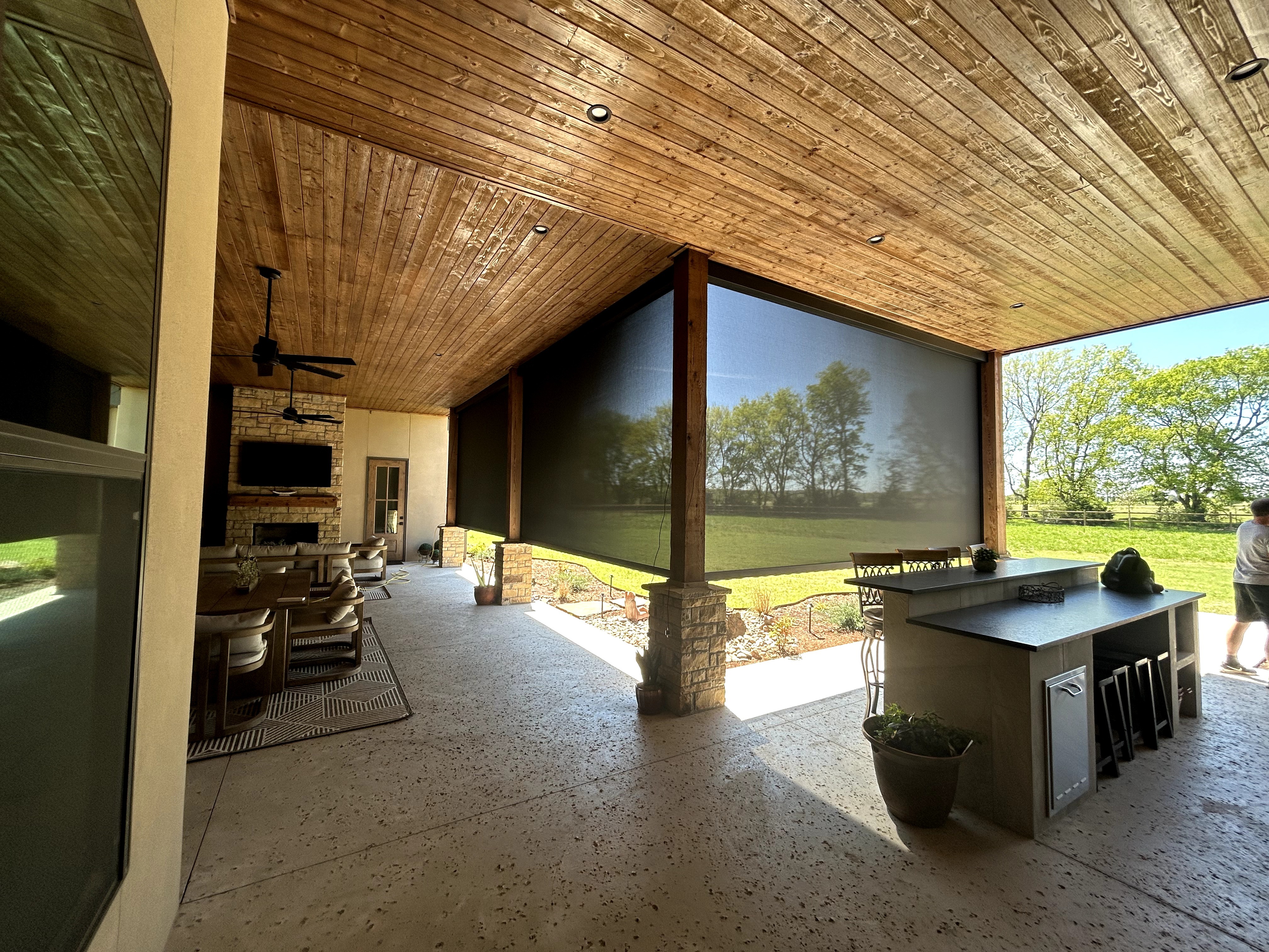 Motorized exterior screen — installed by our sister company, ShadeCo USA