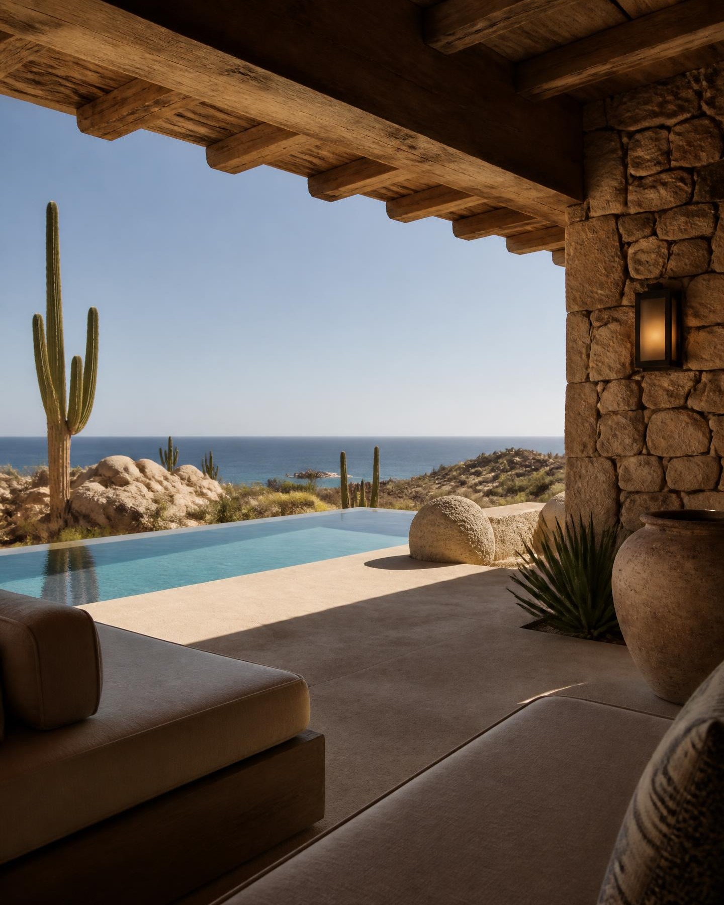 A stone villa in Los Cabos with an infinity pool and cardón cactus.